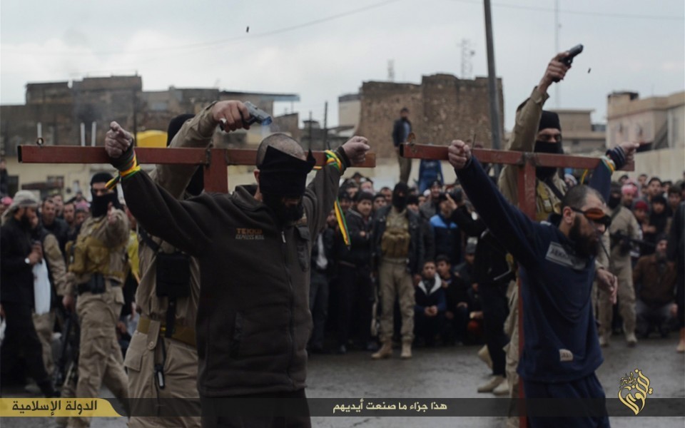 ISIS executions shoot two thieves on point blank range in Mosul. ISIS executions shoot two thieves on point blank range in Mosul.