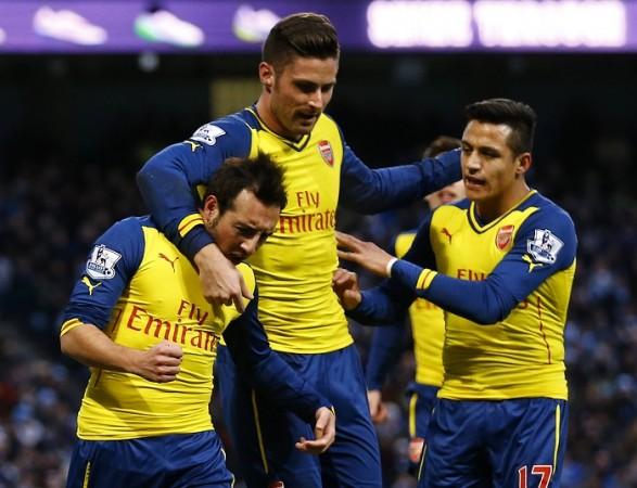 Arsenal midfielder Santi Cazorla celebrates with Olivier Giroud and Alexis Sanchez after scoring against Manchester City in their English Premier League game Santi Cazorla Olivier Giroud Alexis Sanchez Arsenal