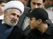 Jihad Moughniyah (R), son of Lebanon's Hezbollah late military leader Imad Moughniyah, sits beside Hizbollah Deputy Secretary General Naeem Kassem during a ceremony marking his fathers 40th death in Beirut's suburbs in this March 24, 2008 file photo.