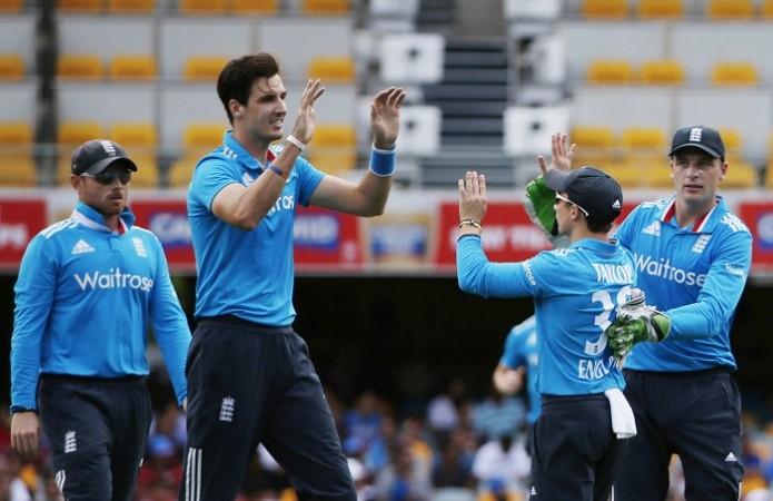 England fast bowler Steven Finn celebrates with teammates after dismissing India opener Ajinkya Rahane Steven Finn England