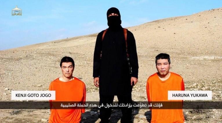 The video shows an ISIS militant threatening to kill the two Japanese hostages. ISIS Japanese hostage