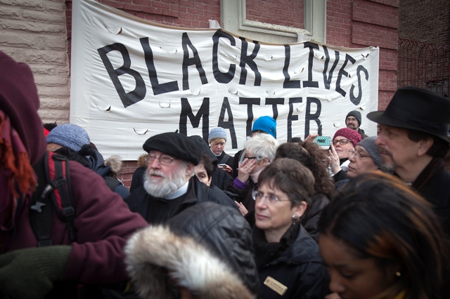 People attend a Martin Luther King day rally in the Harlem section of New York. Martin Luther King Jr. Day