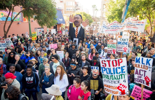 More than a thousand black rights demonstrators gather to mark Martin Luther King Jr. Day in Oakland, California. Martin Luther King Jr. Day Protest