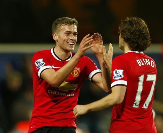 Manchester United striker James Wilson celebrates with Daley Blind after scoring against QPR in the English Premier League James Wilson Daley Blind Manchester United