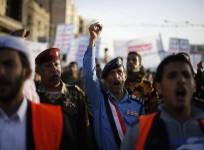 Army and police officers loyal to the Houthi movement shout slogans as they take part in a demonstration to show support to the movement in Sanaa January 23, 2015.
