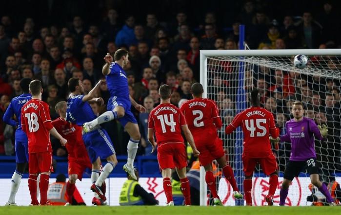Chelsea's Branislav Ivanovic (5th R) scores past Liverpool's Simon Mignolet (R) during their English League Cup semi-final second leg match at Stamford Bridge. Chelsea vs Liverpool