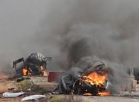 Vehicles burn Wednesday near the village of Ghajar on Israel's border with Lebanon.
