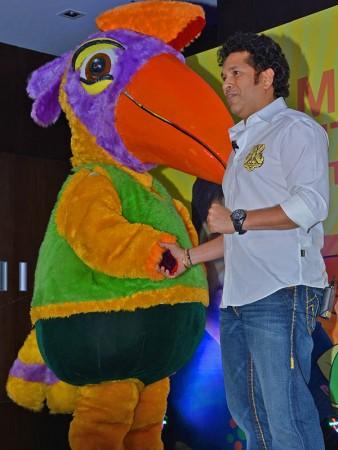 Former India cricketer Sachin Tendulkar poses with Ammu, the official mascot of the 2015 National games of India 015 National games of India