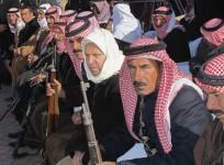 Sunni volunteers carry weapons during a parade as they prepare to fight against militants of the Islamic State, in the town of Amriyat al-Falluja in Anbar province, January 8, 2015.