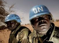 UNAMID peacekeepers patrol on the outskirts of a town in West Darfur