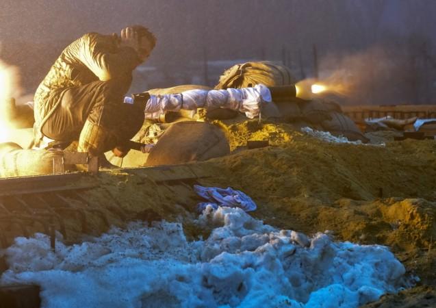 A Ukrainian serviceman fires a weapon during fighting with pro-Russian separatists in Pesky village, near Donetsk January 21, 2015 A Ukrainian serviceman fires a weapon during fighting with pro-Russian separatists in Pesky village, near Donetsk January 21, 2015.
