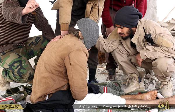 The man being blindfolded before being thrown from a building in Raqqa for being gay. The man being blindfolded before being thrown from a building in Raqqa for being gay.