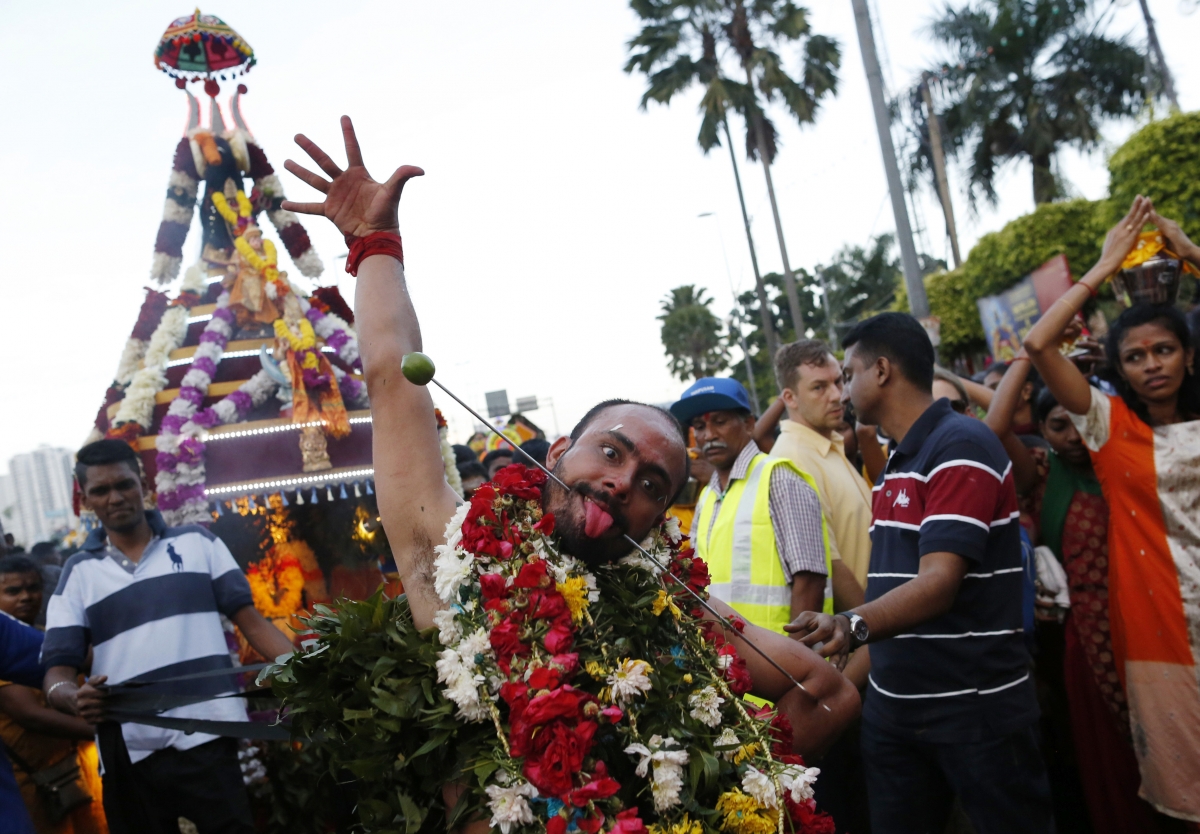 A Hindu devotee dances while on his pilgrimage to the Batu Caves temple during Thaipusam in Kuala Lumpur February 3, 2015. Thaipusam 2015