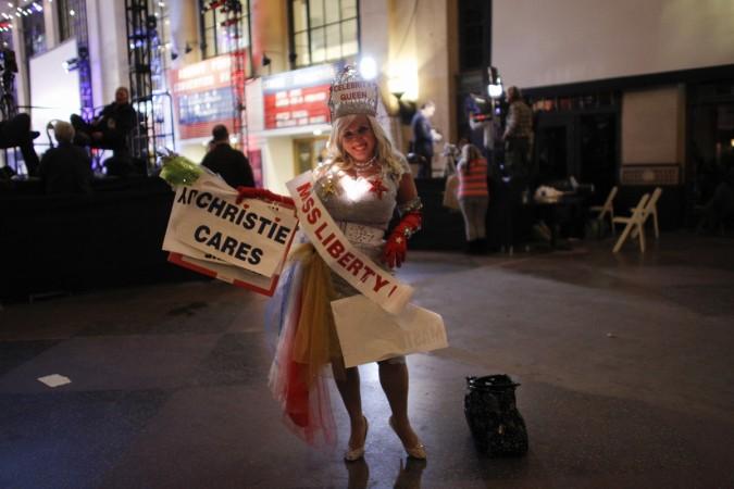 supporter of New Jersey Governor Chris Christie poses with election memorabilia after his victory speech in Asbury Park, New Jersey on November 5, 2013