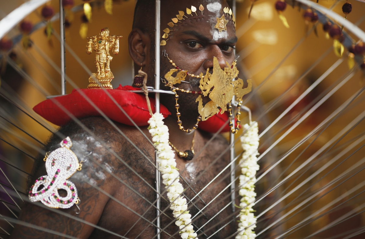 A devotee carrying his kavadi waits to start his procession during Thaipusam festival in Singapore February 3, 2015. Thaipusam 2015