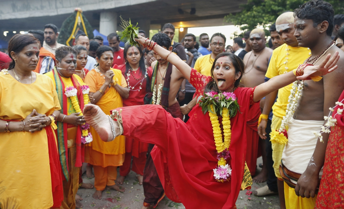 Hindu devotees go into a trance before starting their pilgrimage to the Batu Caves temple during Thaipusam in Kuala Lumpur February 2, 2015. Thaipusam 2015