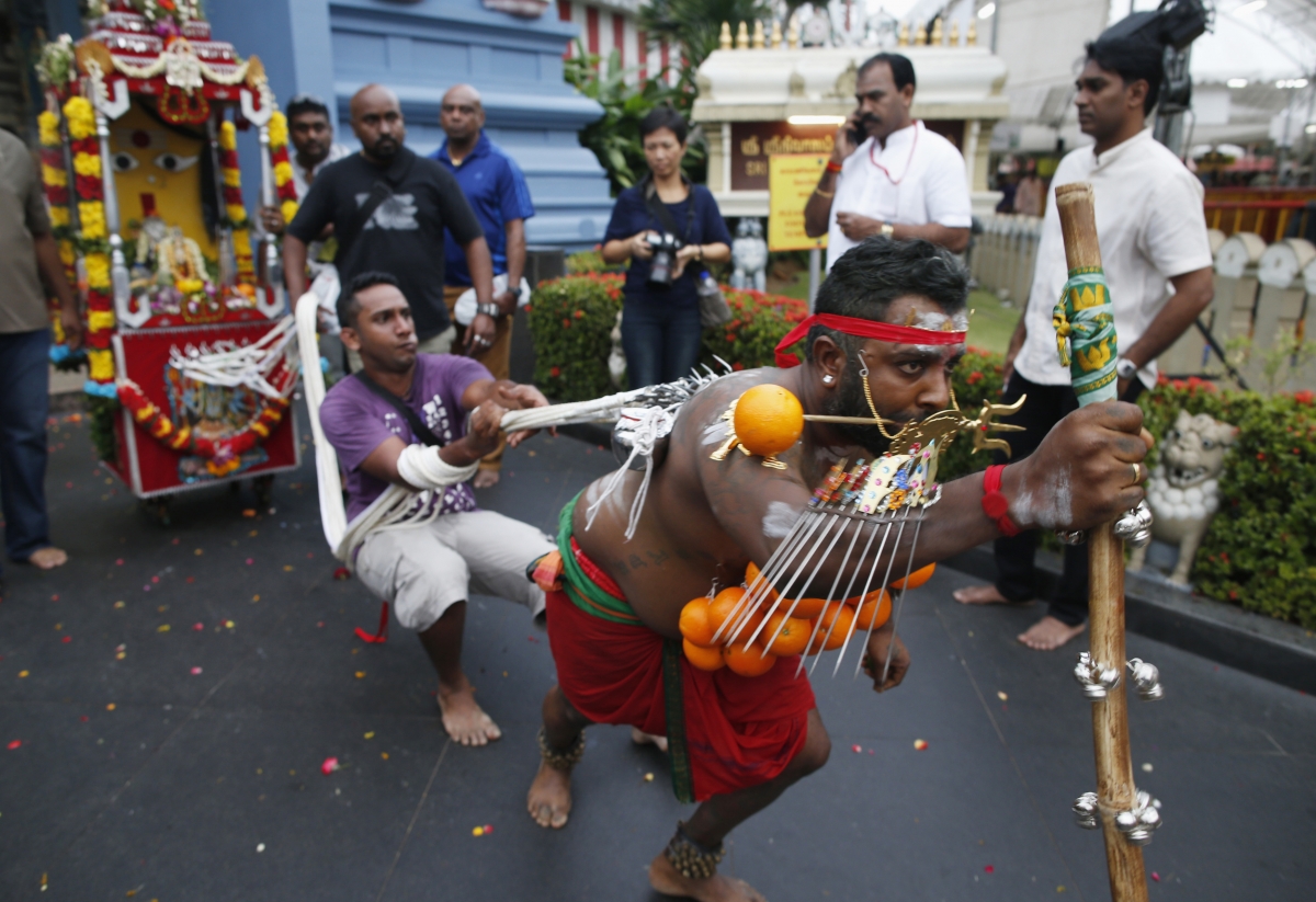 A devotee leaves a temple pulling a chariot during Thaipusam festival in Singapore February 3, 2015. Thaipusam 2015