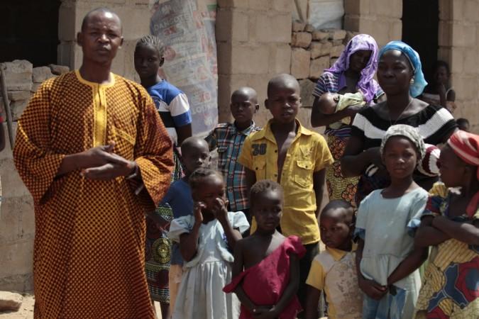 A family, that escaped Boko Haram attacks in both Michika and Cameroon, seek shelter in an uncompleted house in Adamawa January 31, 2015. A family, that escaped Boko Haram attacks in both Michika and Cameroon, seek shelter in an uncompleted house in Adamawa January 31, 2015.