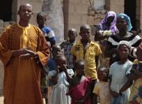 A family, that escaped Boko Haram attacks in both Michika and Cameroon, seek shelter in an uncompleted house in Adamawa January 31, 2015.
