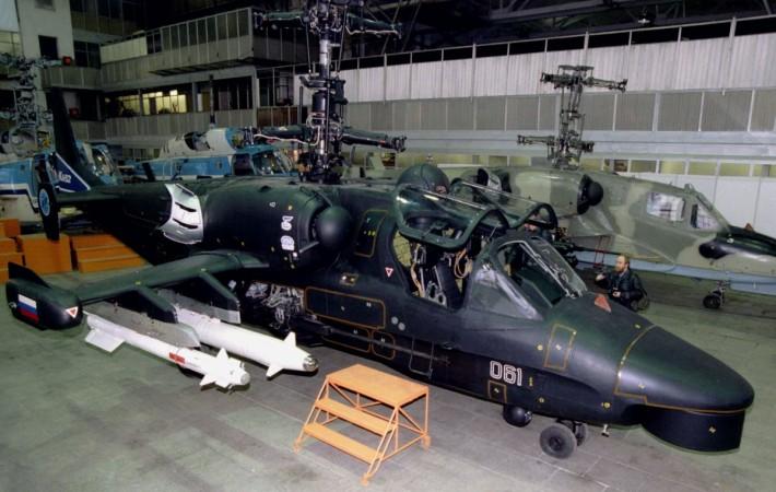 New Russian-made combat helicopter KA-52 nicknamed Alligator is shown for the first time for mass media in the Kamov company outside Moscow, November 19. The $12-14 million two-seat helicopter is equipped by a French-made night-vision device to allow it make reconnaissance and coordinate air and ground forces actions during the combat. Kamov KA - 52