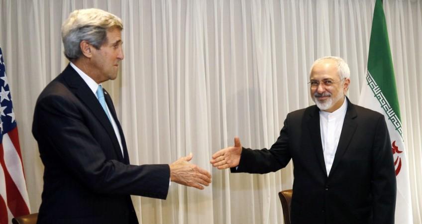U.S. Secretary of State John Kerry shakes hands with Iranian Foreign Minister Mohammad Javad Zarif before a meeting in Geneva January 14, 2015. U.S. Secretary of State John Kerry shakes hands with Iranian Foreign Minister Mohammad Javad Zarif before a meeting in Geneva January 14, 2015.