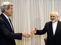 U.S. Secretary of State John Kerry shakes hands with Iranian Foreign Minister Mohammad Javad Zarif before a meeting in Geneva January 14, 2015.