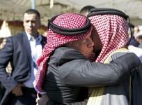 King Abdullah of Jordan consoles Safi al-Kasaesbeh, the father of Jordanian pilot Muath al-Kasaesbeh