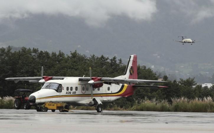 An Agni Air plane, a German-made Dornier 228 that is similar to the model that crashed on Tuesday, taxis at the domestic airport in Kathmandu. Dornier 228