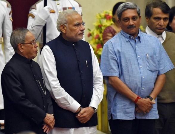 (From L to R) India's President Pranab Mukherjee, Prime Minister Narendra Modi, new cabinet ministers Manohar Parrikar and Suresh Prabhu pose after a swearing-in ceremony at the presidential palace in New Delhi. Defence Minister Manohar Parrikar