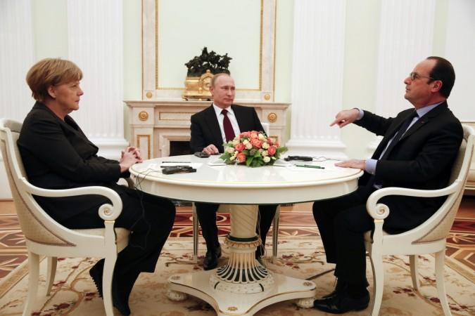 German Chancellor Angela Merkel and Russia's President Vladimir Putin (C) listen to French President Francois Hollande during a meeting on resolving the Ukraine crisis at the Kremlin in Moscow February 6, 2015. German Chancellor Angela Merkel and Russia's President Vladimir Putin (C) listen to French President Francois Hollande during a meeting on resolving the Ukraine crisis at the Kremlin in Moscow February 6, 2015.