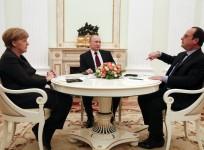 German Chancellor Angela Merkel and Russia's President Vladimir Putin (C) listen to French President Francois Hollande during a meeting on resolving the Ukraine crisis at the Kremlin in Moscow February 6, 2015.
