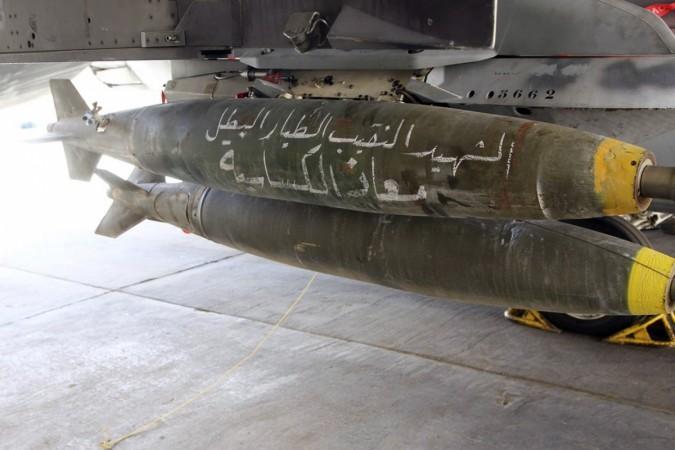 Bombs are pictured on a Royal Jordanian Air Force plane at an air base before it's launch to strike the Islamic state in the Syrian city of Raqqa. Jordan air strikes on Islamic State