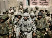 Major-General Mark Hertling (C), the commander of the U.S. forces in northern Iraq, walks during a battlefield circulation patrol on the streets in Mosul in June 19, 2008 file photo.
