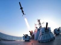 A missile is fired from a naval vessel during the test-firing of a new type of anti-ship cruise missile to be equipped at Korean People's Army (KPA) naval units in this undated photo released by North Korea's Korean Central News Agency (KCNA) in Pyongyang