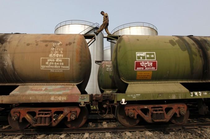 A Railway Worker inspecting tanker wagons