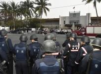 Police officers stand guard outside Kaohsiung Prison, southern Taiwan, February 11, 2015.