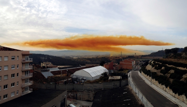 An orange toxic cloud is seen over the town of Igualada, near Barcelona following an explosion in a chemical plant. Orange Toxic Cloud in Spain