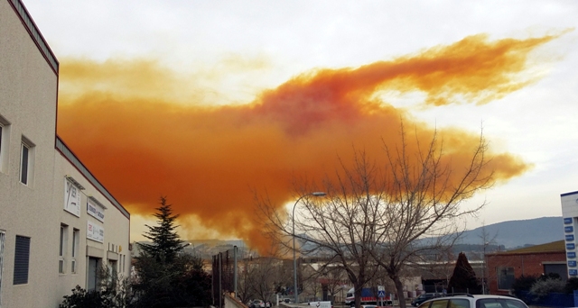 An orange toxic cloud is seen over the town of Igualada, near Barcelona following an explosion in a chemical plant. Orange Toxic Cloud in Spain