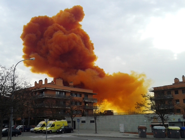 An orange toxic cloud is seen over the town of Igualada, near Barcelona following an explosion in a chemical plant. Orange Toxic Cloud in Spain