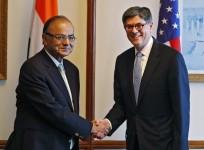 U.S. Treasury Secretary Jack Lew (R) shakes hands with India's Finance Minister Arun Jaitley