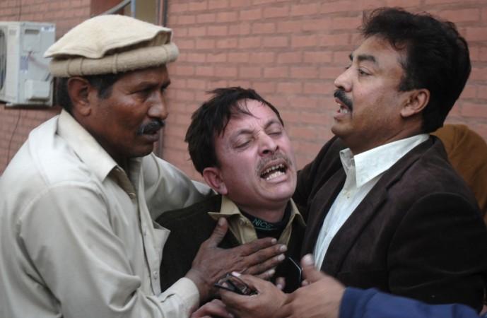 A man cries over the death of his relative, who was killed in an explosion in a Shi'ite mosque, outside a hospital in Peshawar February 13, 2015. A man cries over the death of his relative, who was killed in an explosion in a Shi'ite mosque, outside a hospital in Peshawar February 13, 2015.