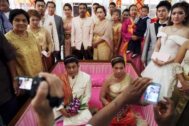 Bride and Groom Exchange Wedding Vows in Coffins in Bangkok