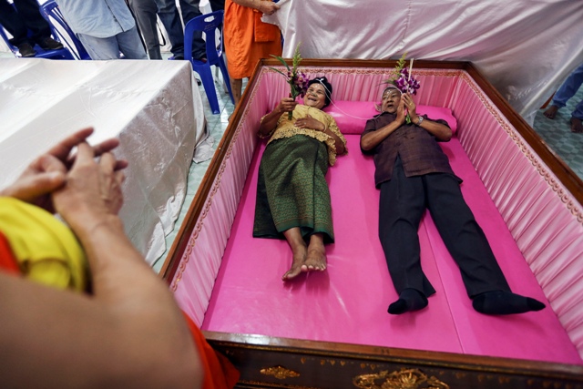 Bride and Groom Exchange Wedding Vows in Coffins in Bangkok.