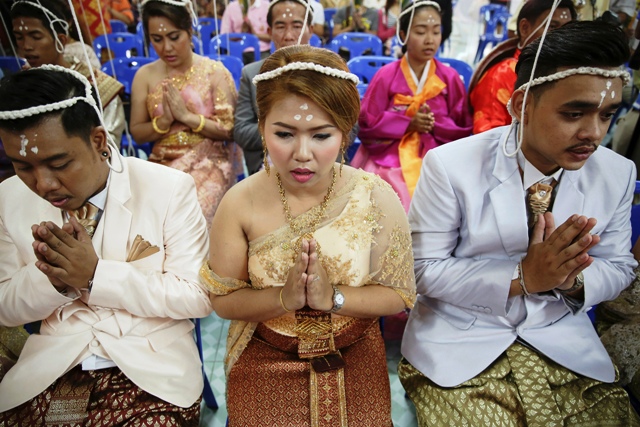 Bride and Groom Exchange Wedding Vows in Coffins in Bangkok.