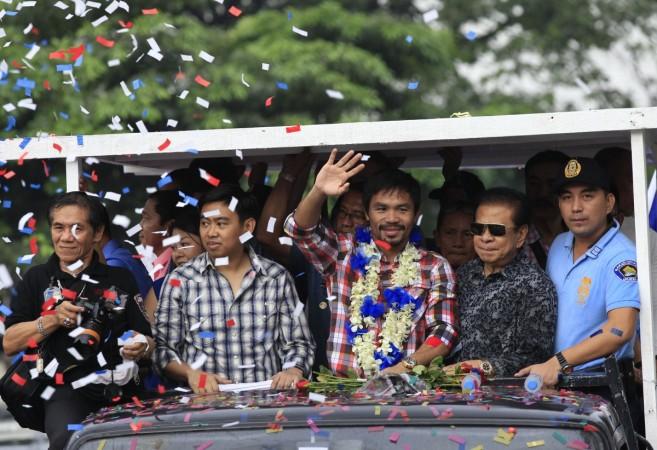 Manny Pacquiao (waving his hand) has expressed his desire to fight the American more than once Manny Pacquiao