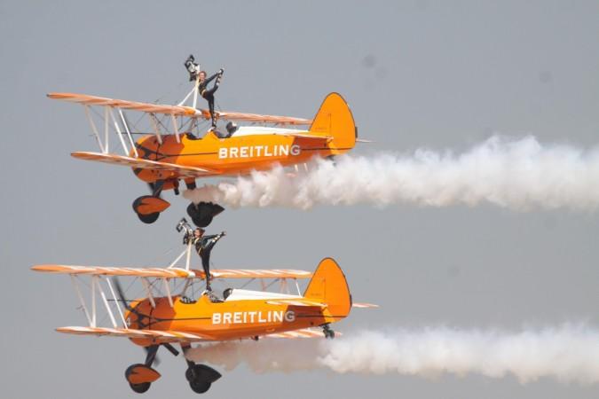 IAF aircrafts perform aerobatics during the Aero India-2015 Air Show, at Yelahanka Air-force Station, in Bengaluru on Feb 18, 2015. (Photo: IANS) AE 3