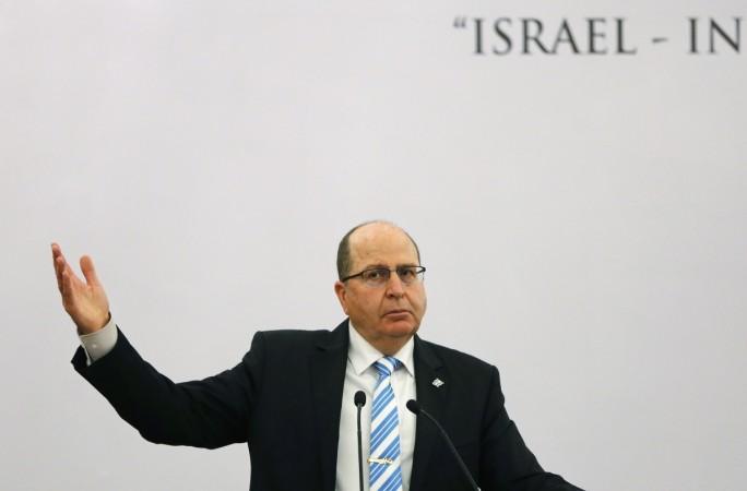 Israeli Defence Minister Moshe Ya'alon gestures while addressing a gathering during a lecture themed Israeli Defence Minister Moshe Ya'alon