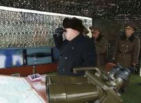 North Korean leader Kim Jong Un (C) guides artillery fire and landing exercises in this undated photo released by North Korea's Korean Central News Agency (KCNA) in Pyongyang February 21, 2015.