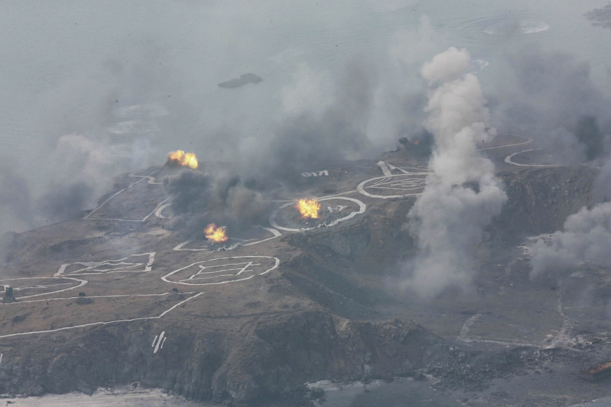 A view of artillery fire and landing exercises guided by North Korean leader Kim Jong Un (not seen) in this undated photo released by North Korea's Korean Central News Agency (KCNA) in Pyongyang February 21, 2015.