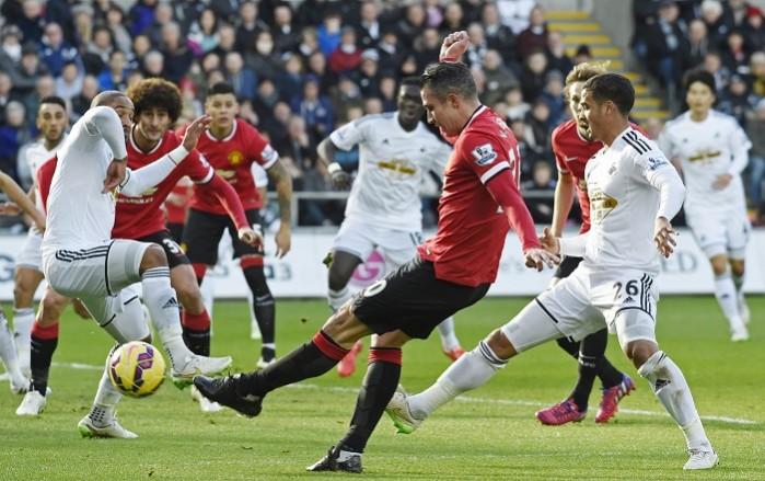 Manchester United's Robin van Persie shoots at goal during his side's Premier League clash against Swansea City on Saturday Manchester United